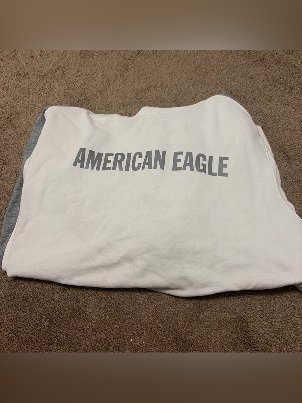 American Eagle White Pullover with Black Tag Detail
